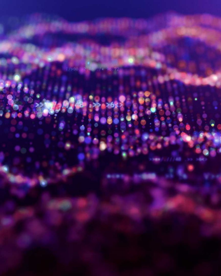Colorful dots of light in hues of purple. 