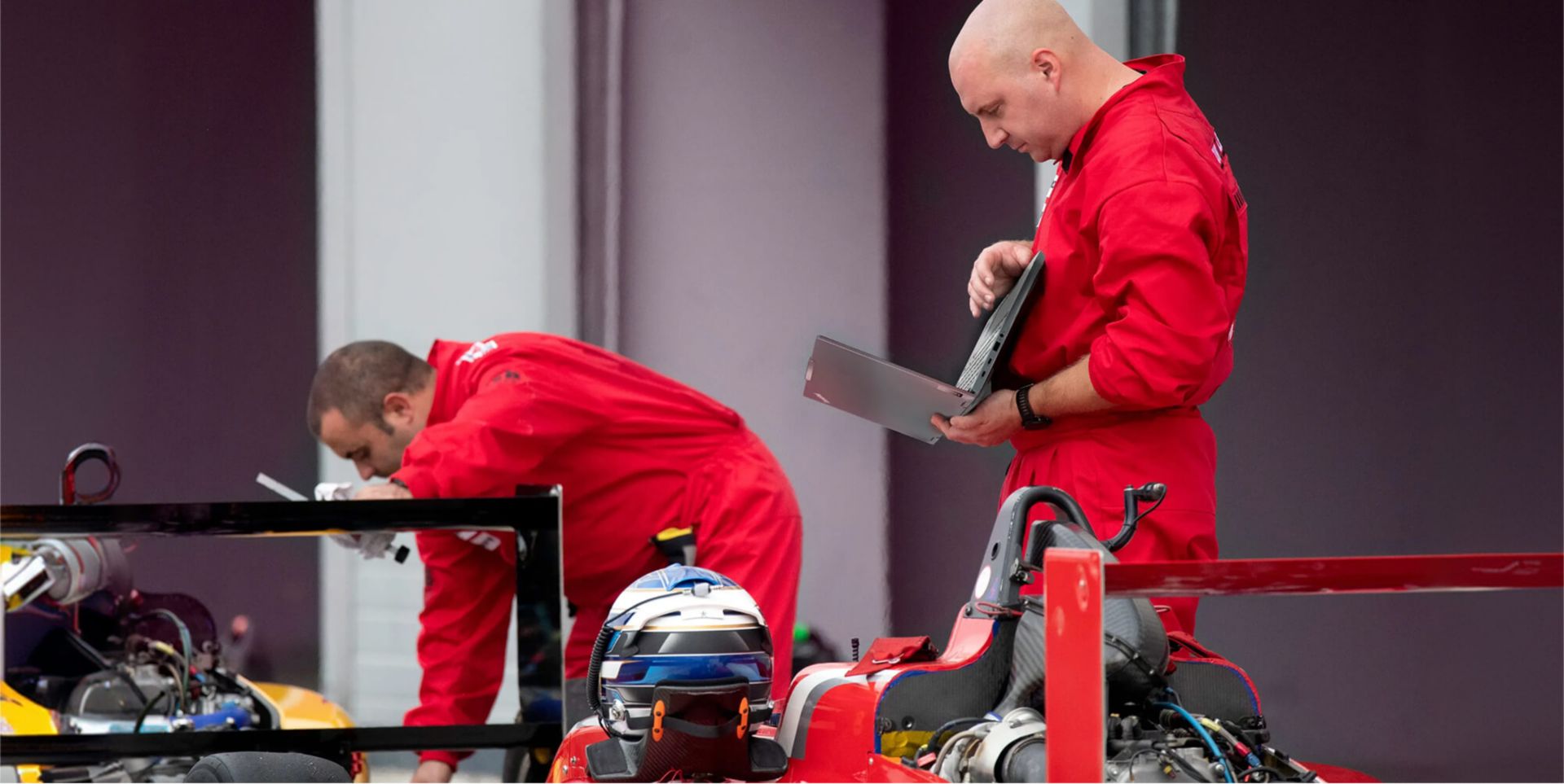 Technicians working on a Formula 1® race car.