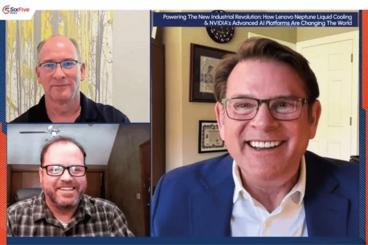 Three people meeting in a web hosted meeting smiling and talking