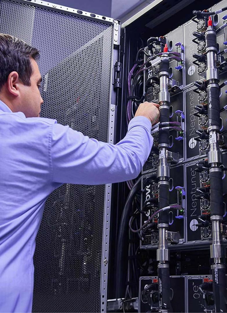 A man working on a liquid cooling system.
