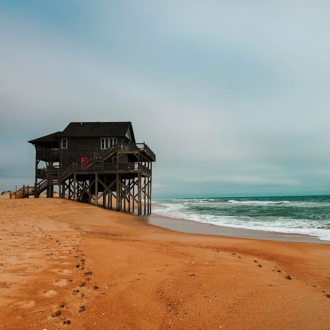 A beach house in North Carolina that is perilously close to the shoreline.
