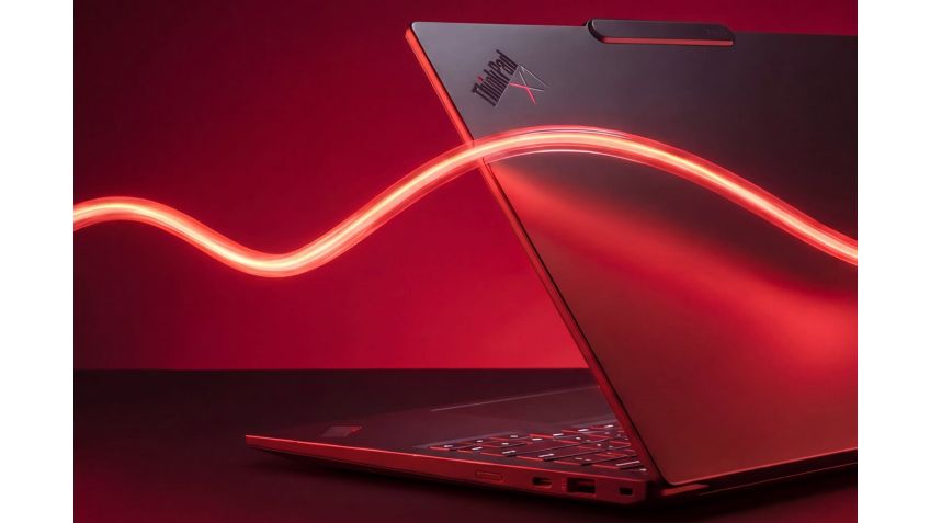 A red light swirling in front of a partially open ThinkPad.