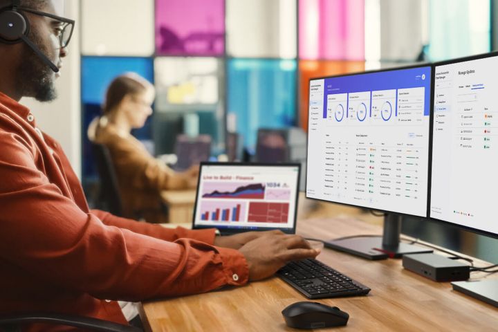 A man at work typing on a keyboard.
