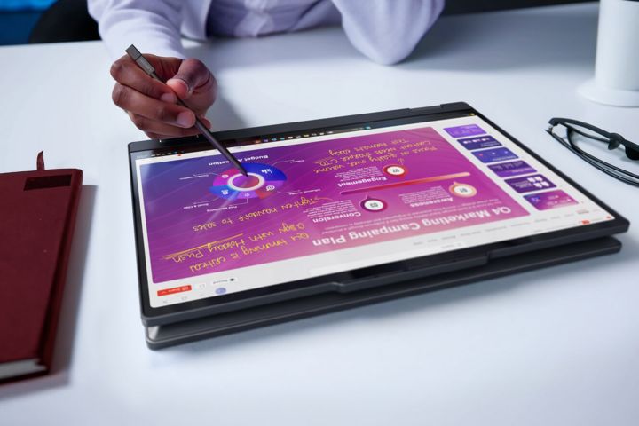 A pen writing on a tablet.