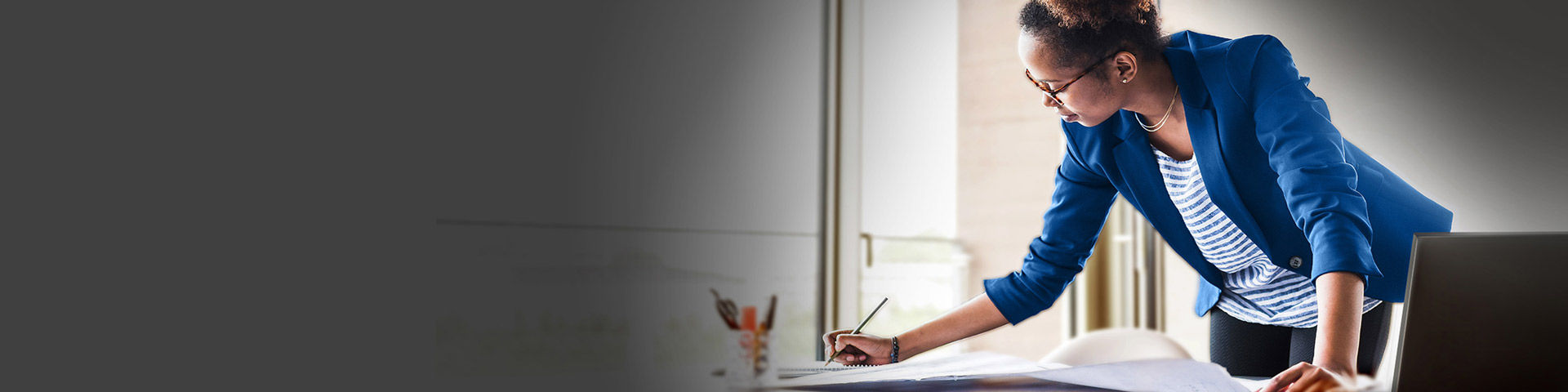 Image of woman working at a desk