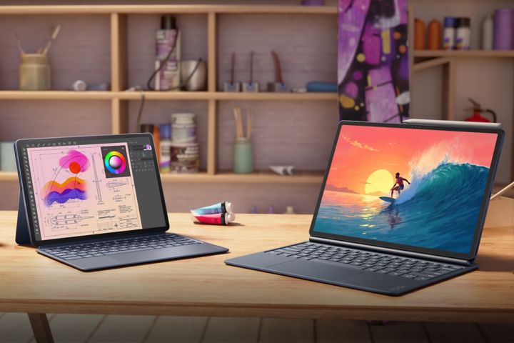 Two Yoga tablets on a desk in an artist’s studio. 