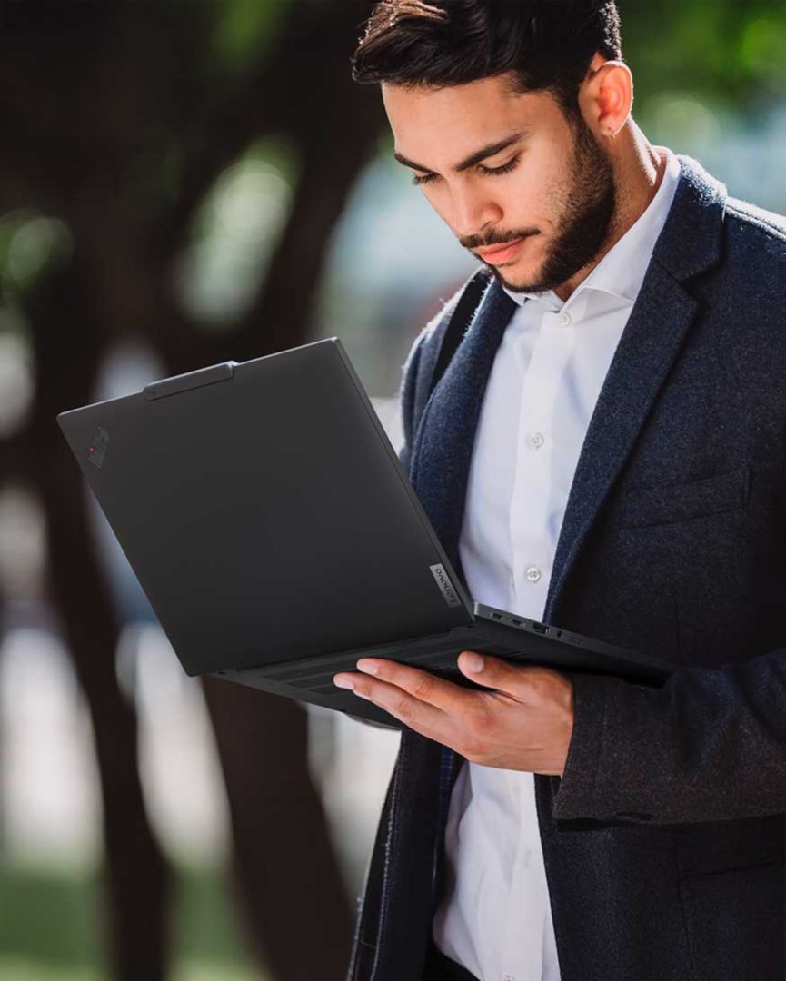 A man using his Workstation laptop outside. 