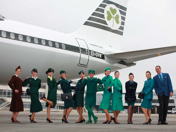 aer lingus flight attendants next to airplane