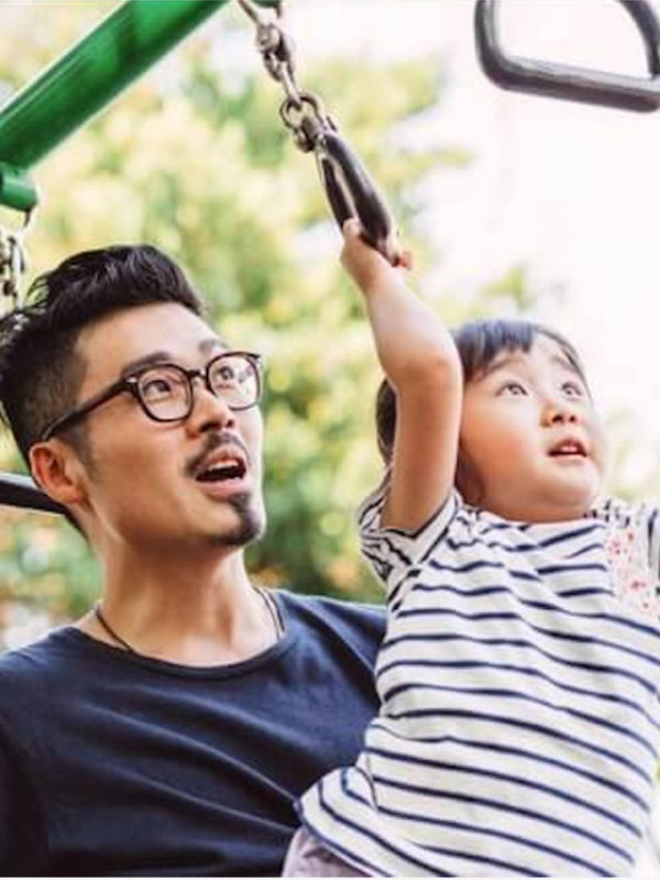 father and child on playground