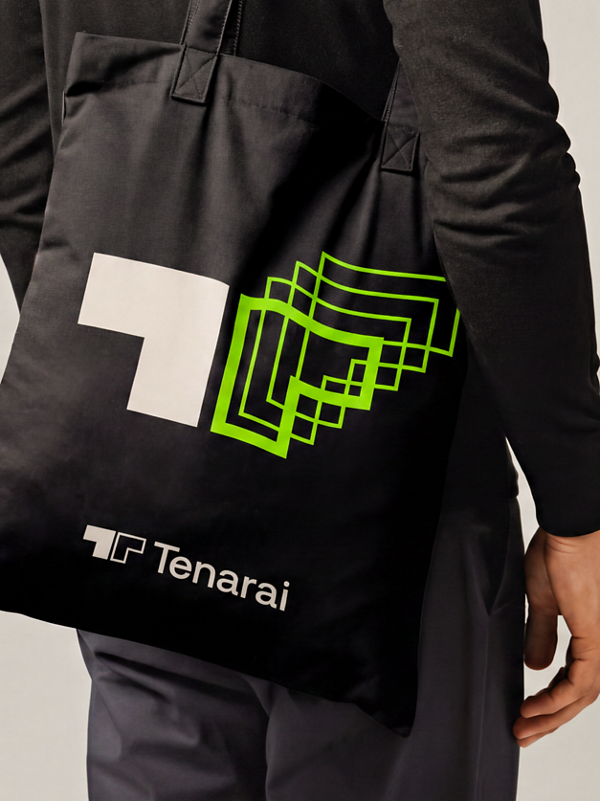 Black Tenarai tote bag featuring white and bright green geometric brand graphics.
