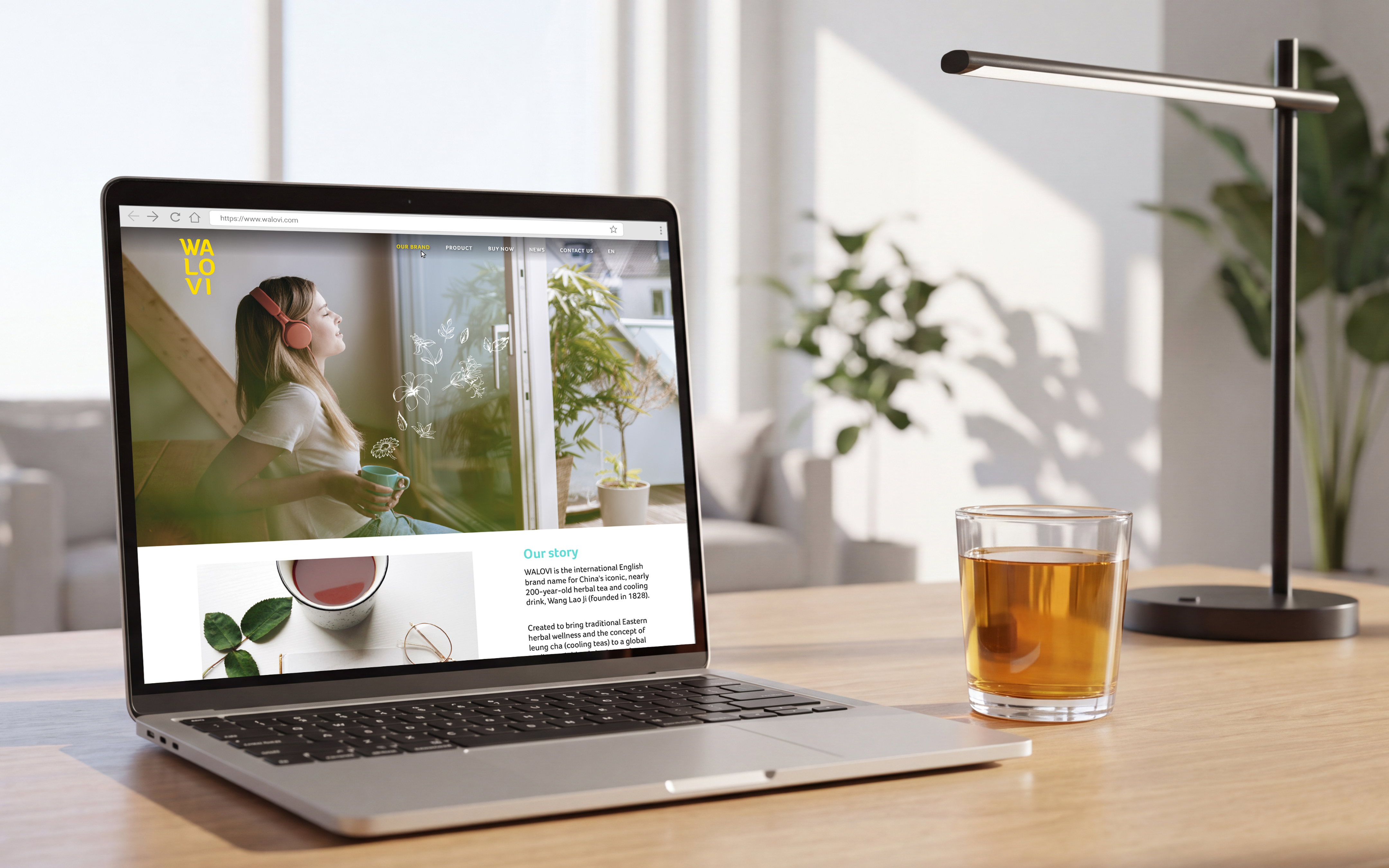 WALOVI website on laptop screen, with tea cup
