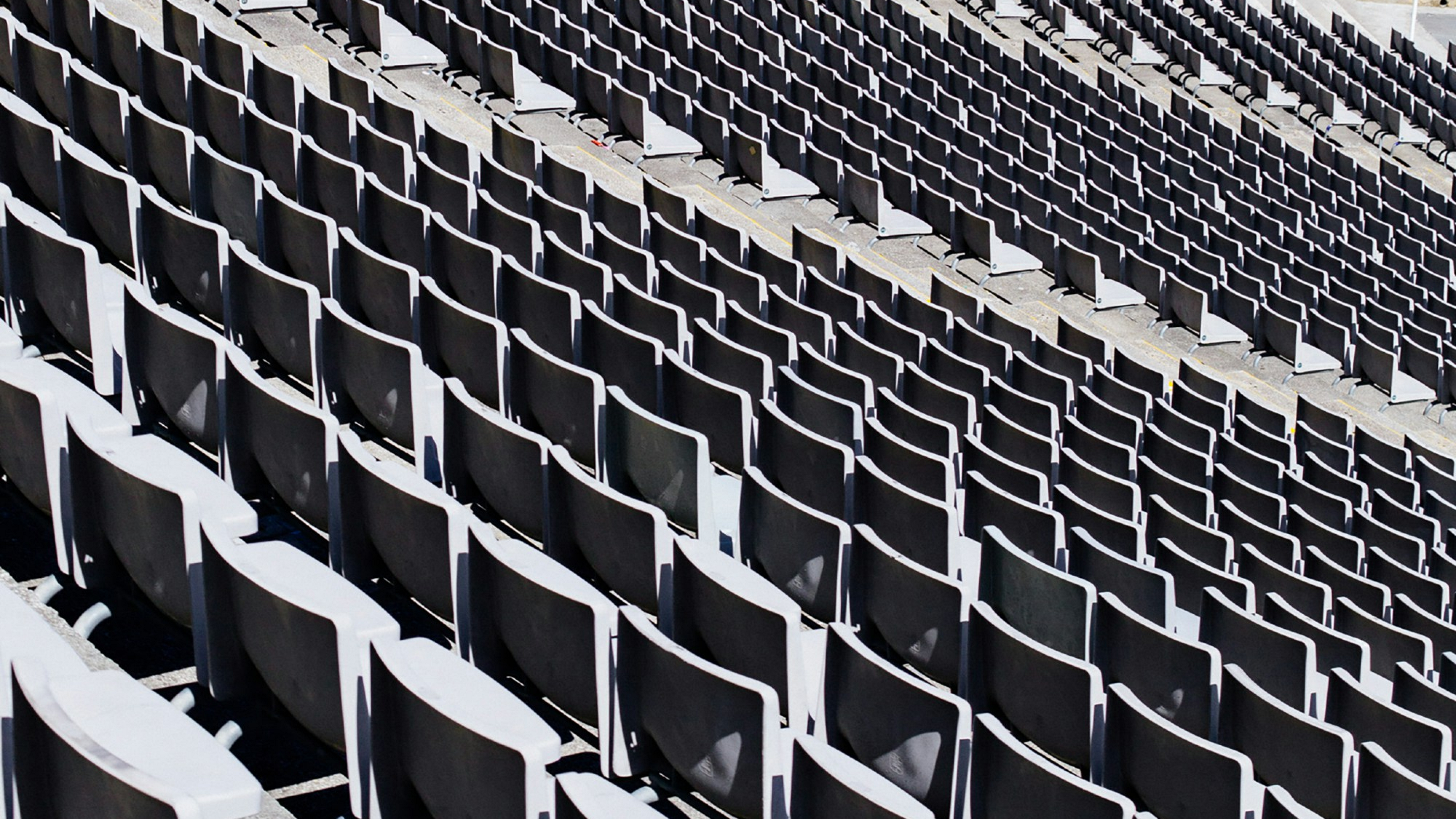 Wide view of empty stadium seating.