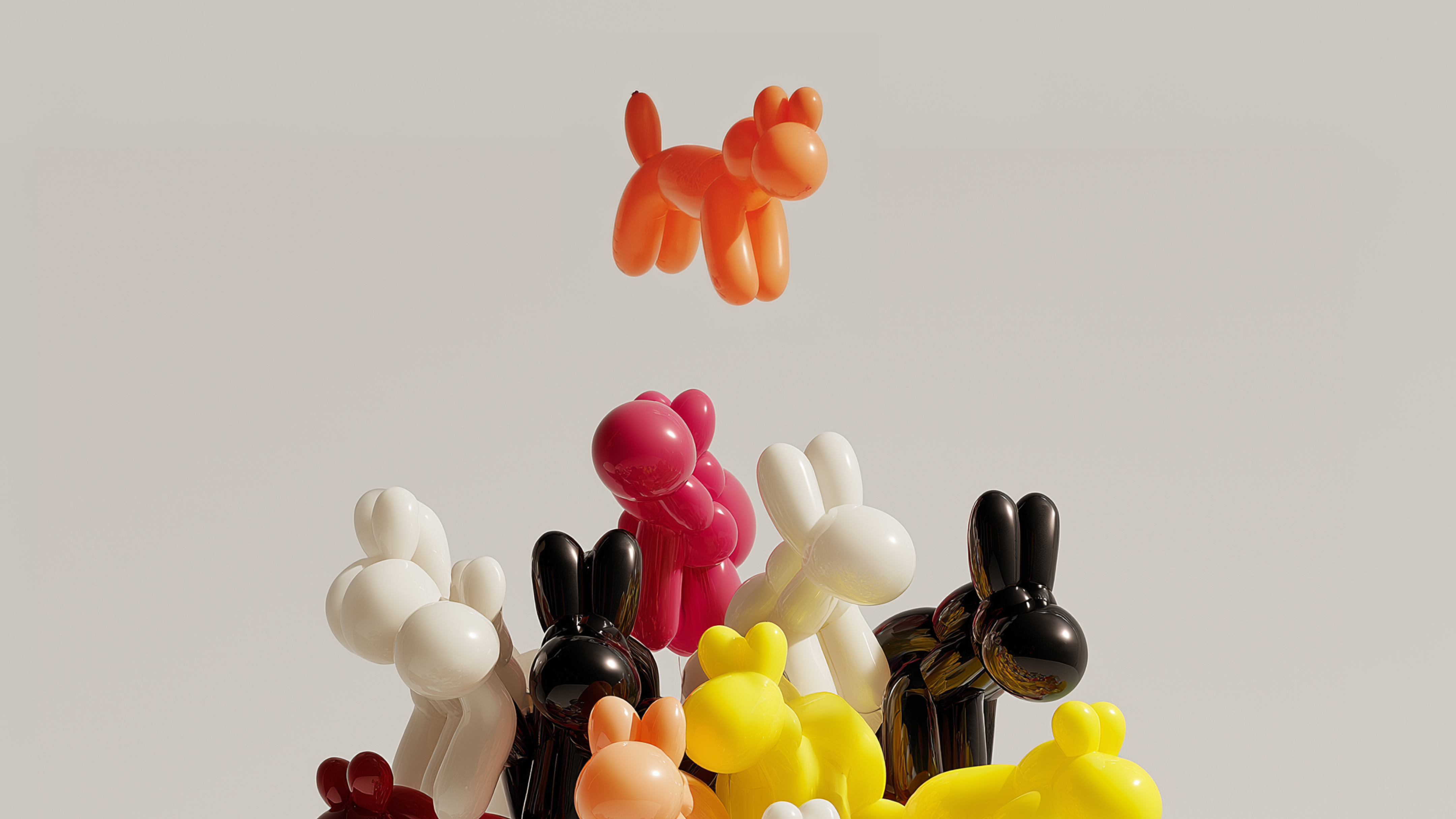 group of glossy balloon-animal sculptures in bright orange, pink, yellow, cream, and black, clustered together against a neutral beige background. One orange balloon animal floats above the group.