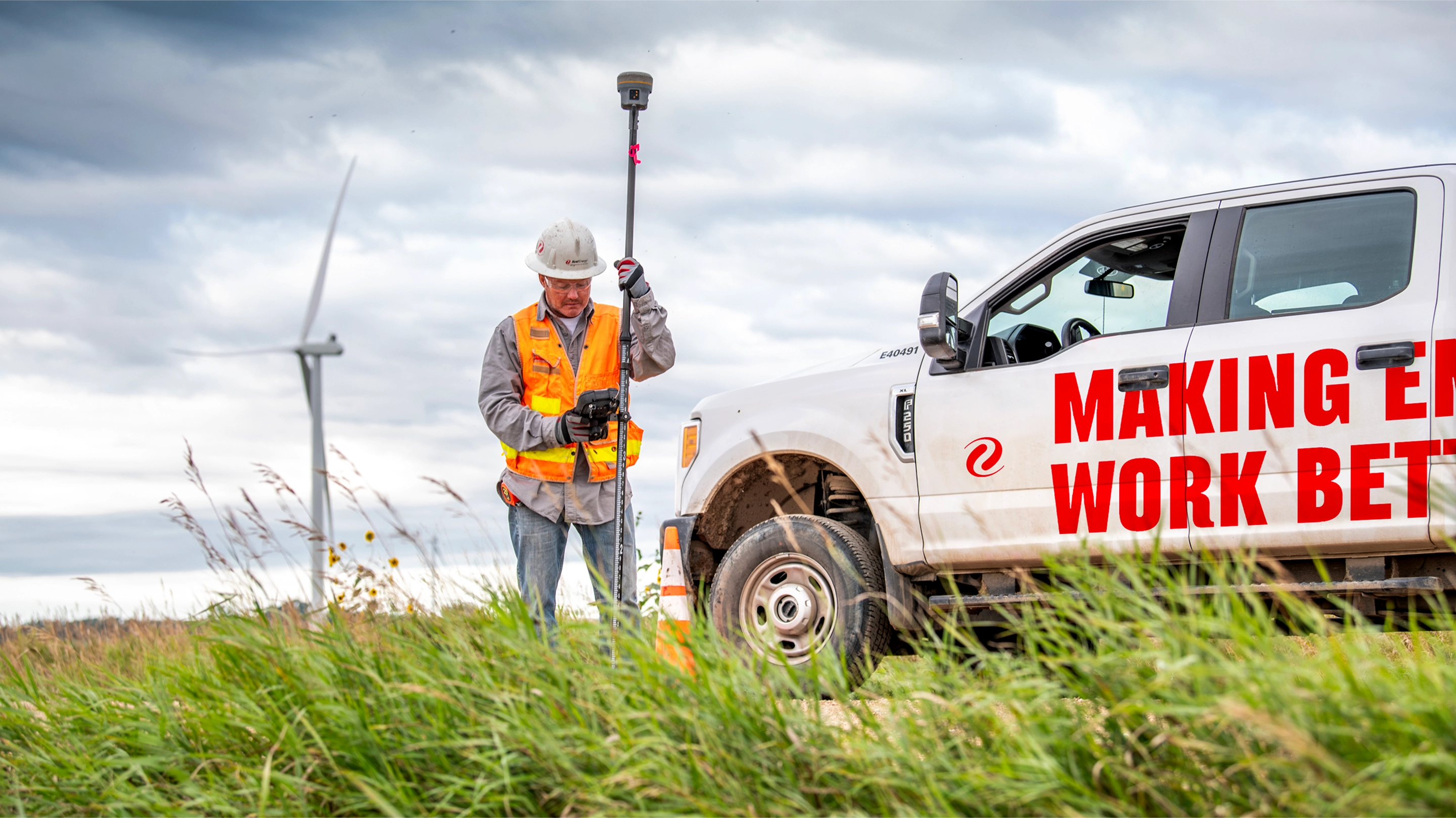 xcel energy working in a field