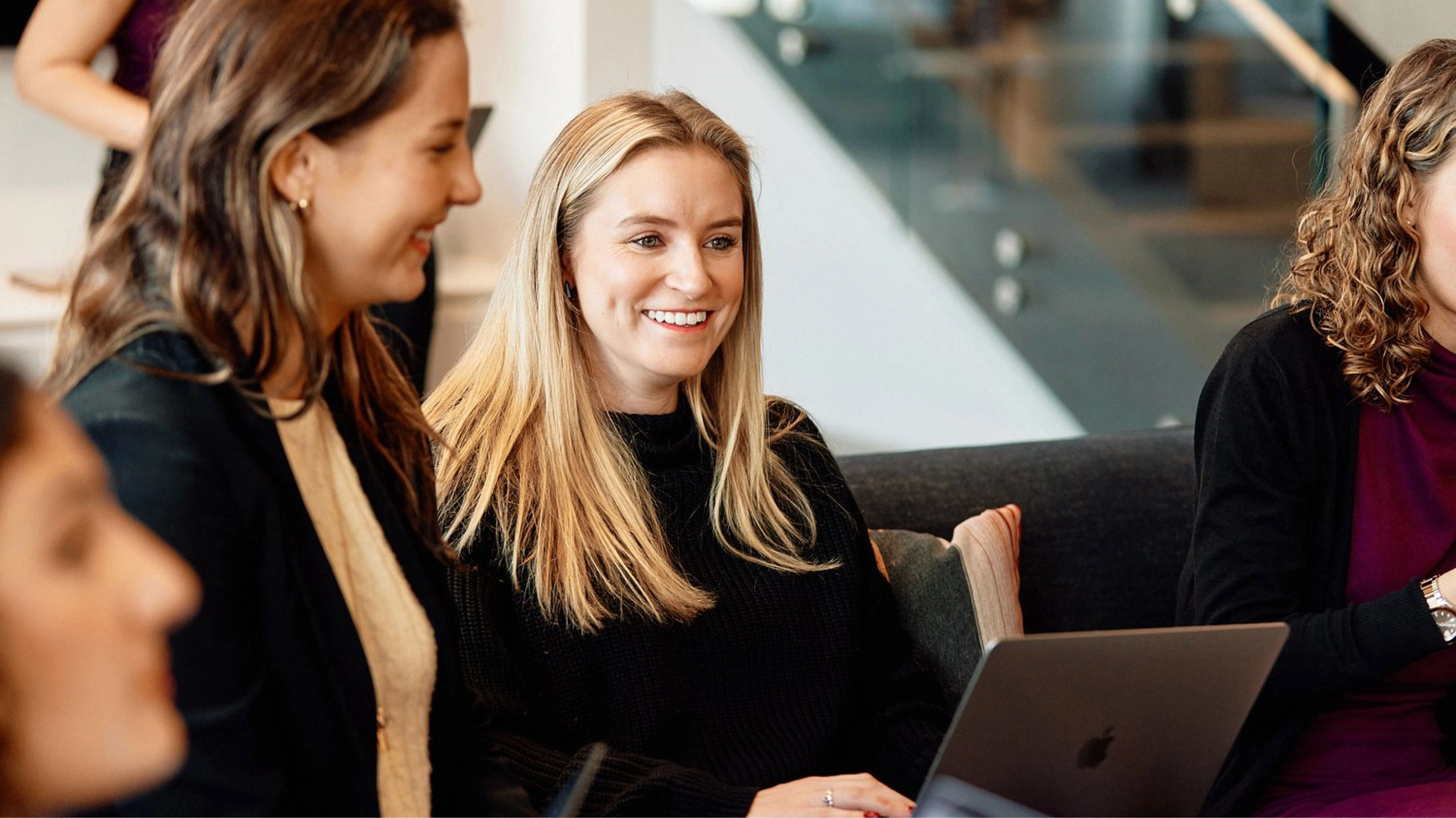 Lippincott employees talking in office