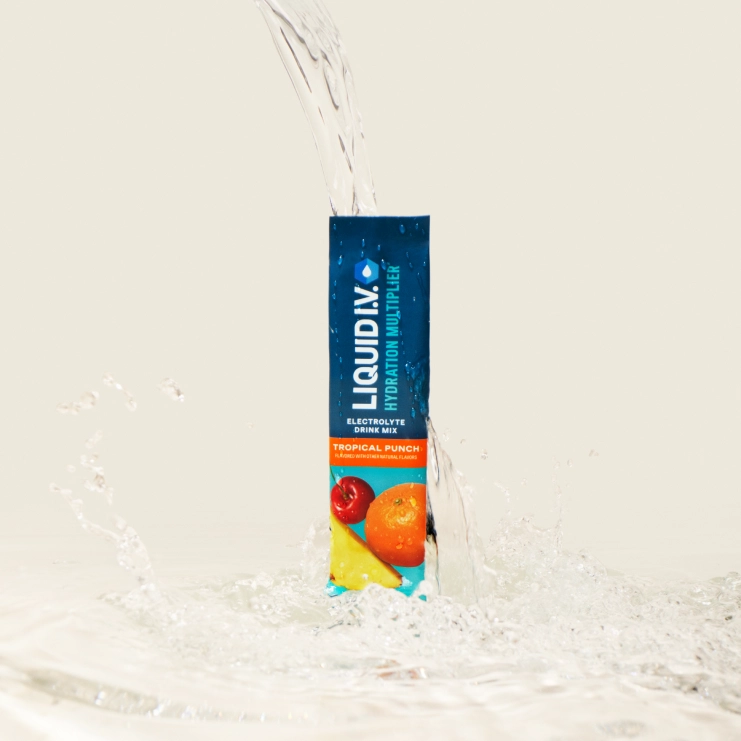 Liquid IV with water spilled over it