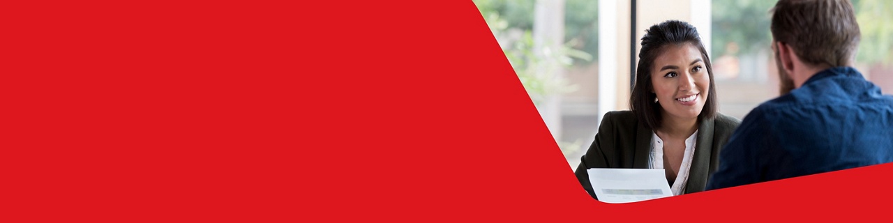 Photo of an advisor showing the National Bank loan insurance to their client 