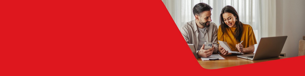 Photo of a couple planning their budget based on the mortgage borrowing capacity they calculated