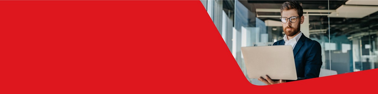 Photo of a business owner managing their National Bank Business Client Card on their computer 