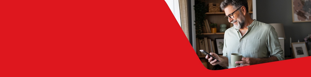 Photo of a man reviewing his GIC options over the phone