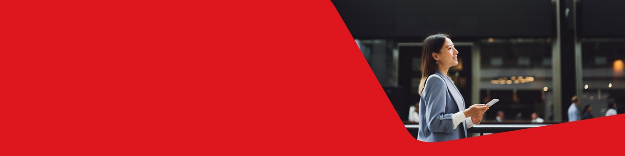 Photo of an entrepreneur managing their cash management and depository service from their cell phone 