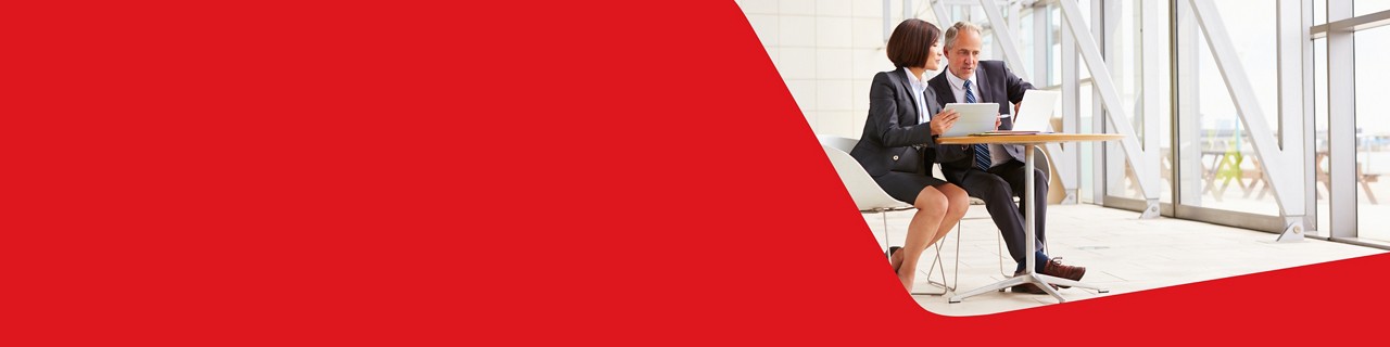 Photo of two businesspeople in an office discussing National Bank’s Global Trade Solutions