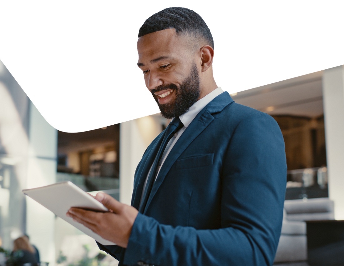 Photo of a businessperson choosing the National Bank Premium Business Package on their tablet in an office building