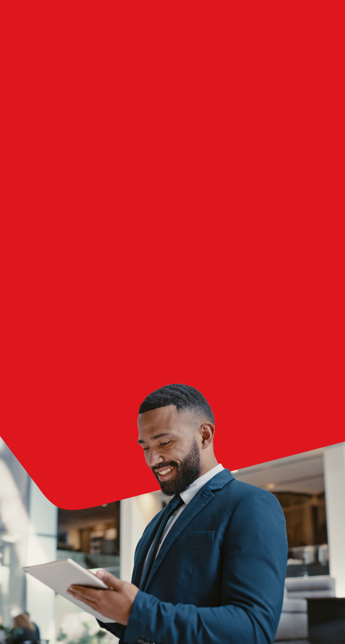 Photo of a businessperson choosing the National Bank Premium Business Package on their tablet in an office building