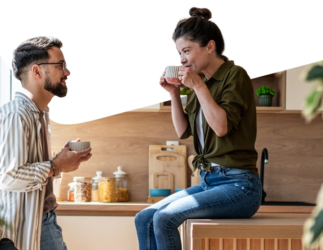Photo of a couple discussing alternative mortgage options while drinking coffee in the kitchen