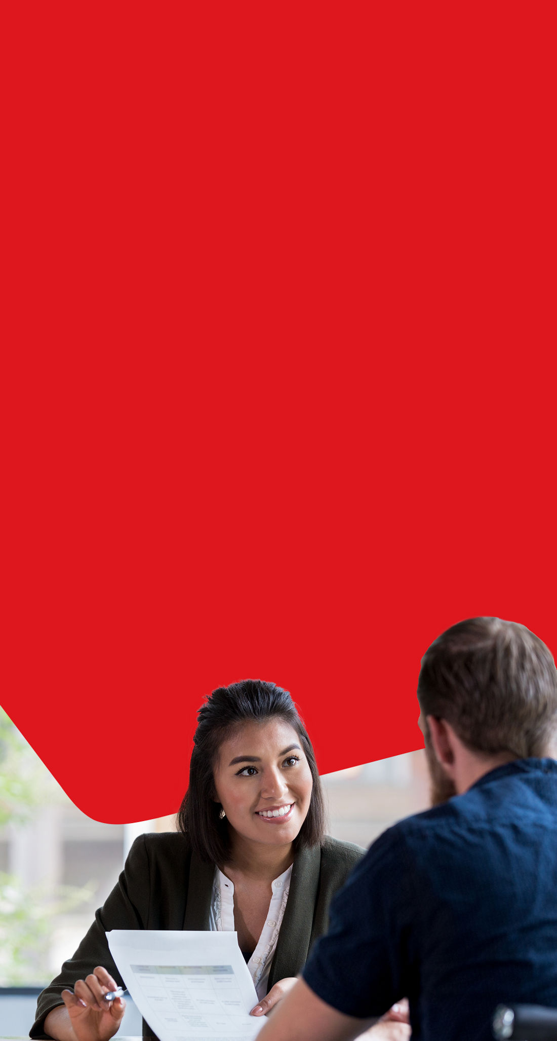 Photo of an advisor showing the National Bank loan insurance to their client 