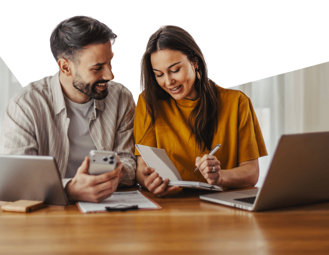 Photo of a couple planning their budget based on the mortgage borrowing capacity they calculated