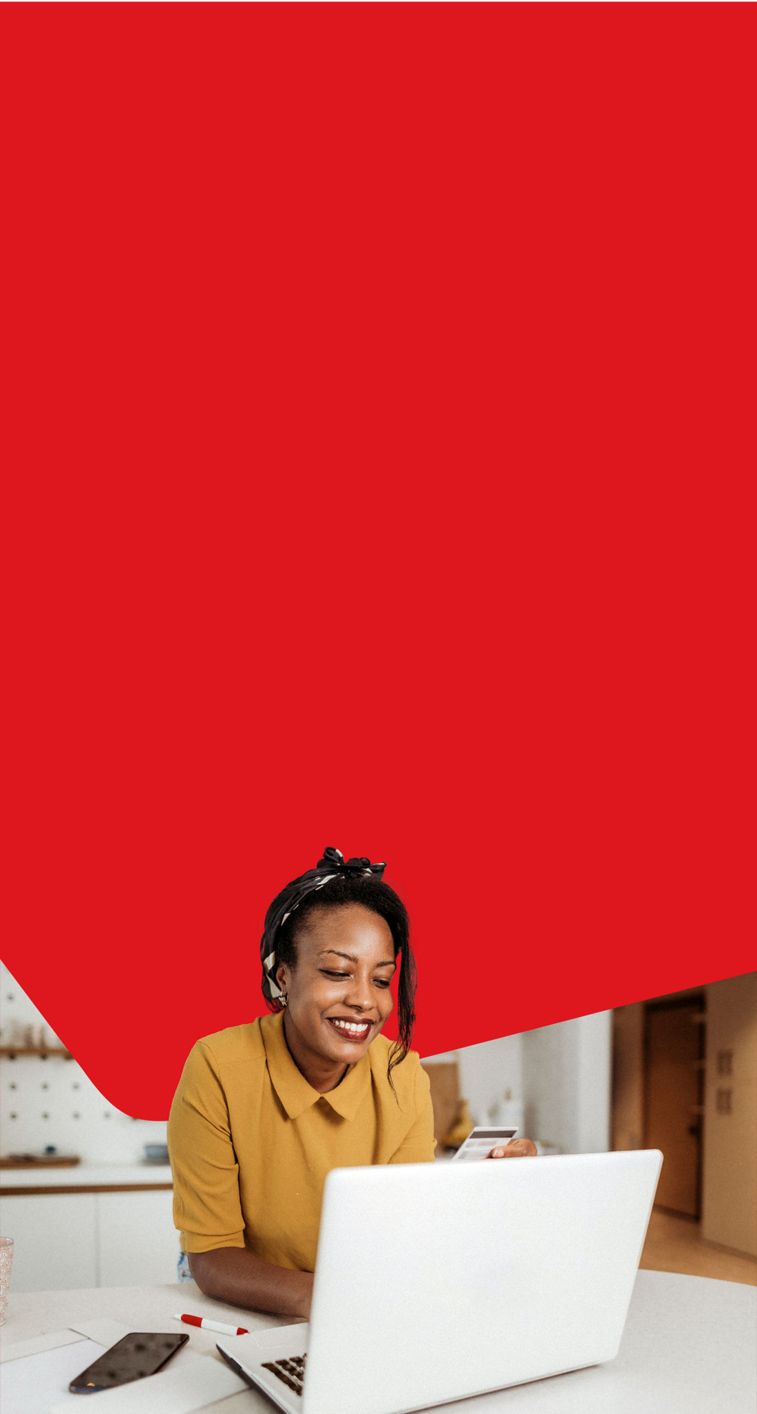 Photo of a woman looking at National Bank Mastercard credit cards on her computer 