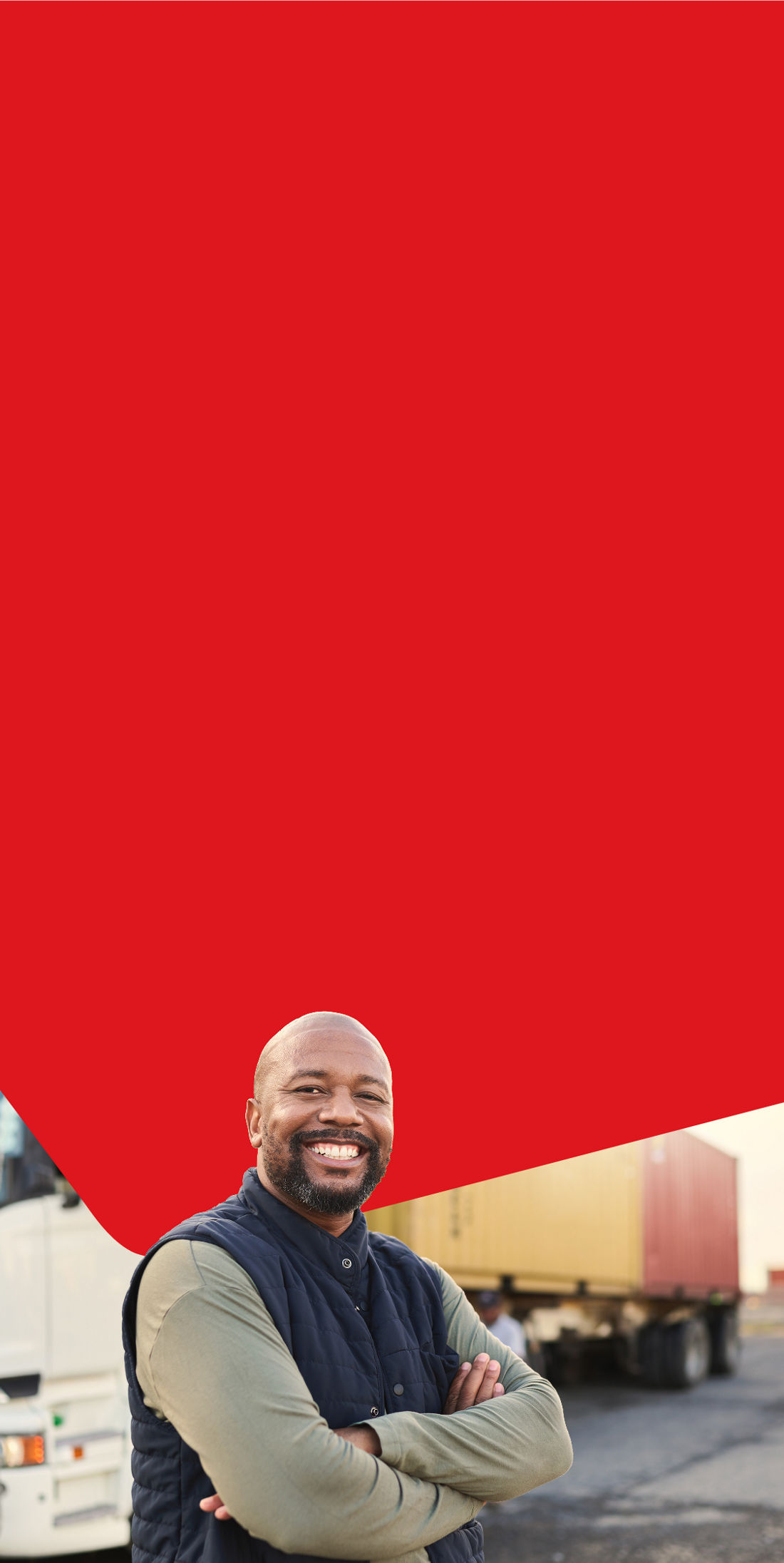 Photo of a smiling businessowner in front of his truck that is a part of his cross-border operations 