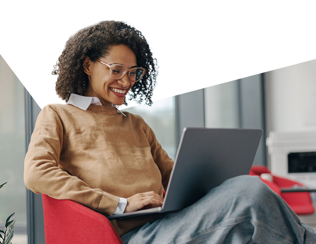 Photo of a client happy to find how to contact us on her computer