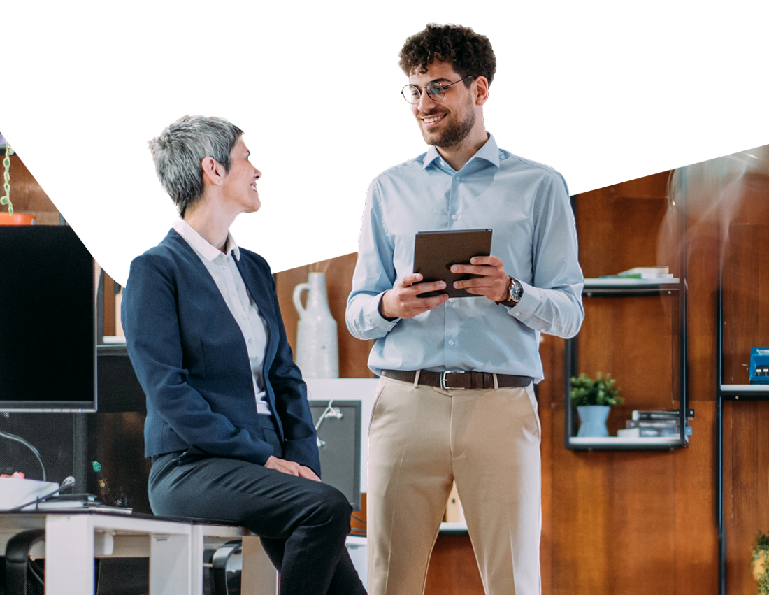 Photo of two entrepreneurs discussing how National Bank’s business growth plan can help them grow their business 