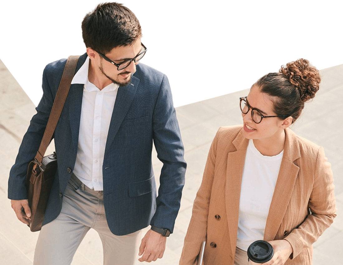 Photo of two professionals discussing their capital investments with NBC Global Finance while walking