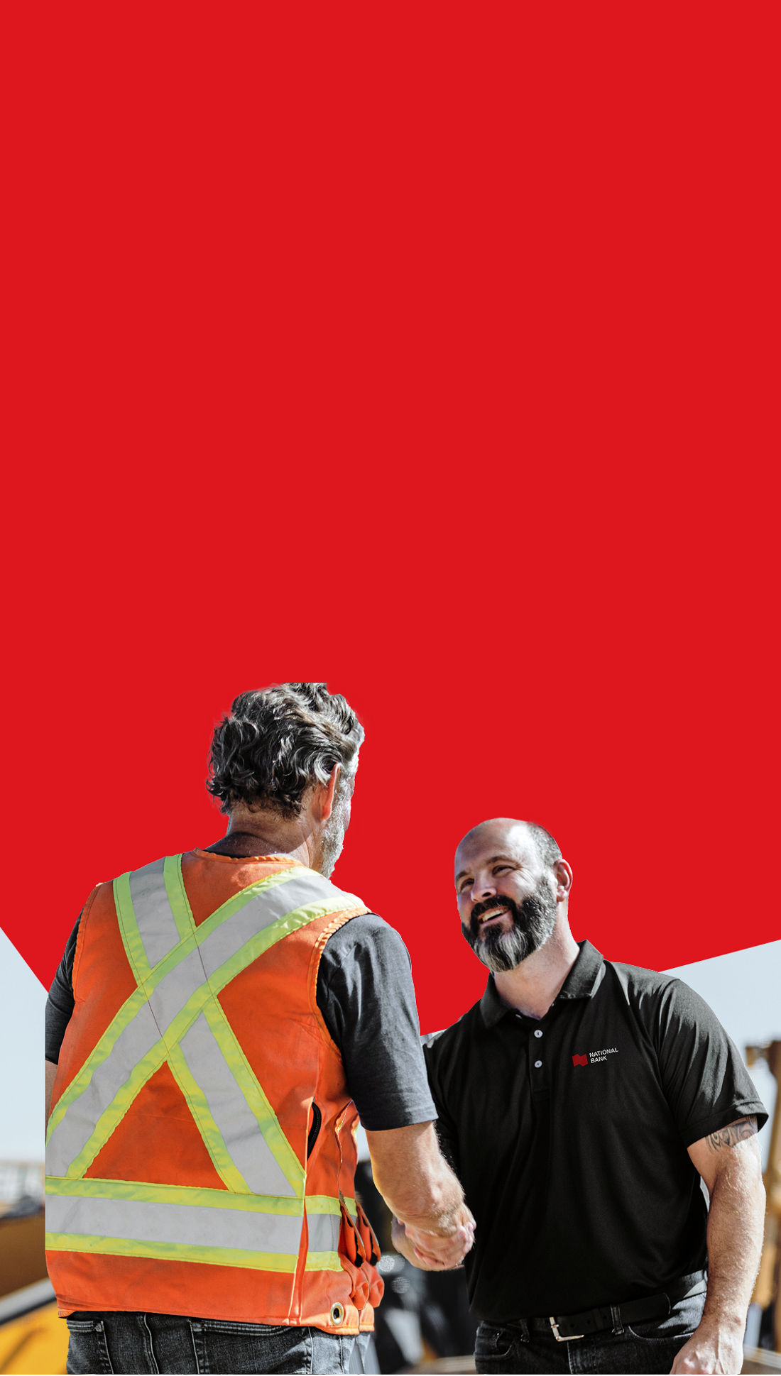 Photo of a business owner and a National Bank expert discussing how choosing National Bank for their equipment financing needs could help their business