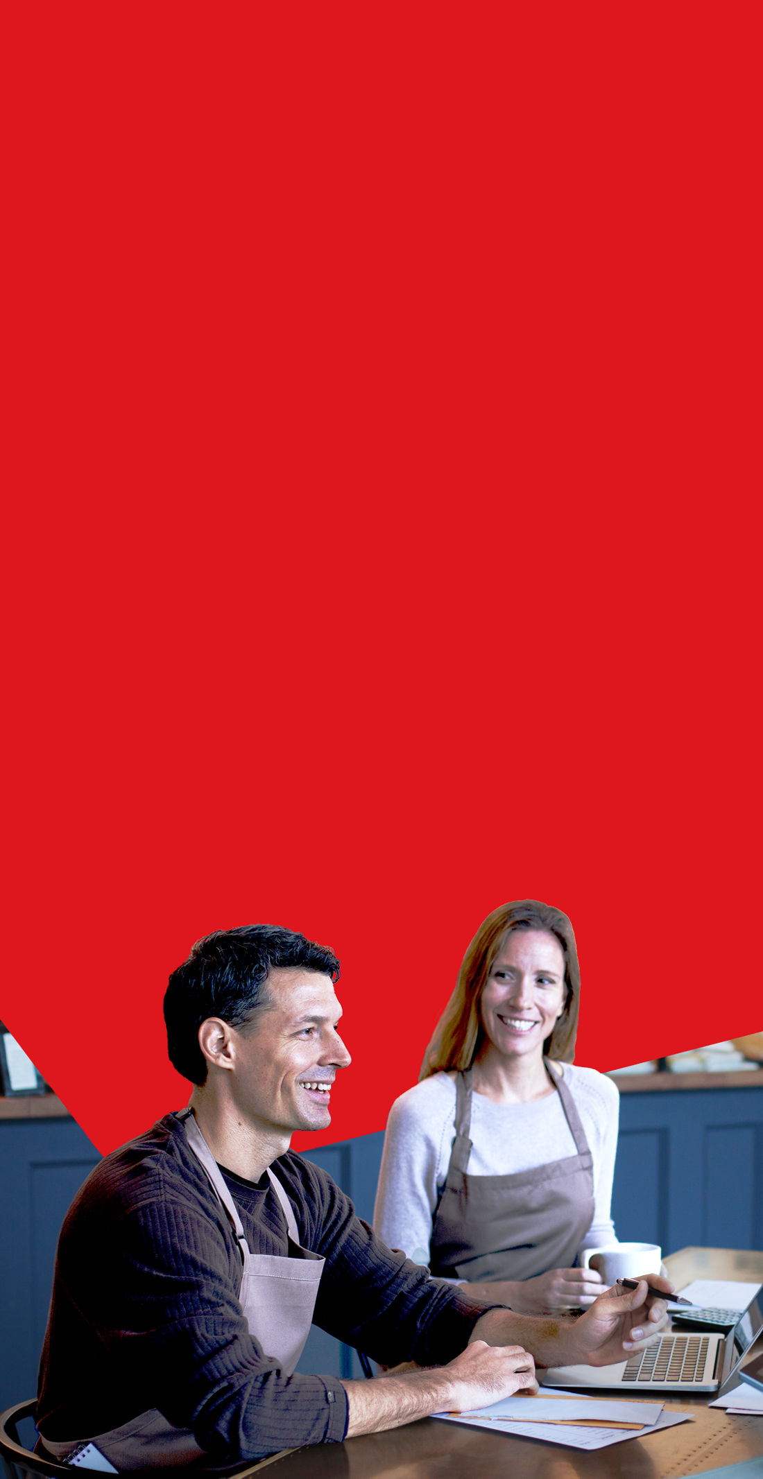 Photo of two restaurant owners discussing their short-term financing needs with a National Bank advisor 