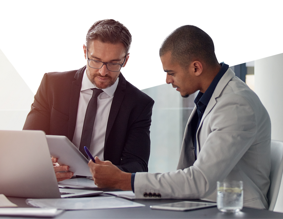 Photo of two businessowners in an office discussing ways to optimize their business management with National Bank 
