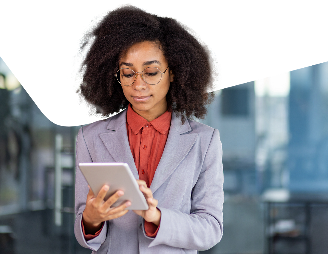 Photo of a professional looking at the services offered by National Bank partners on their tablet