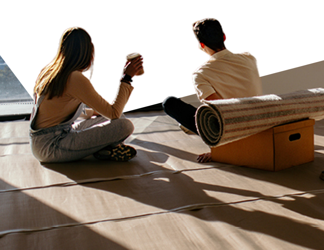 Photo of a couple looking out the window while thinking about our rates
