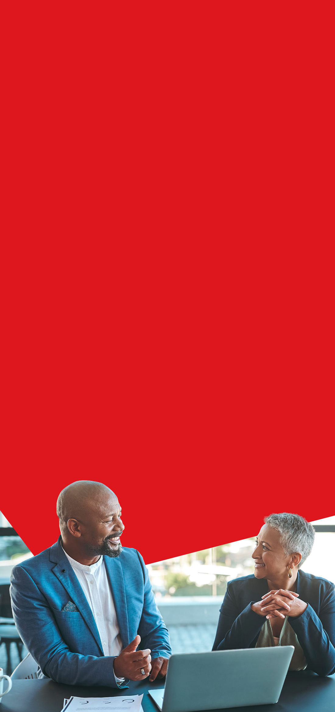 Photo of two managers discussing the different 