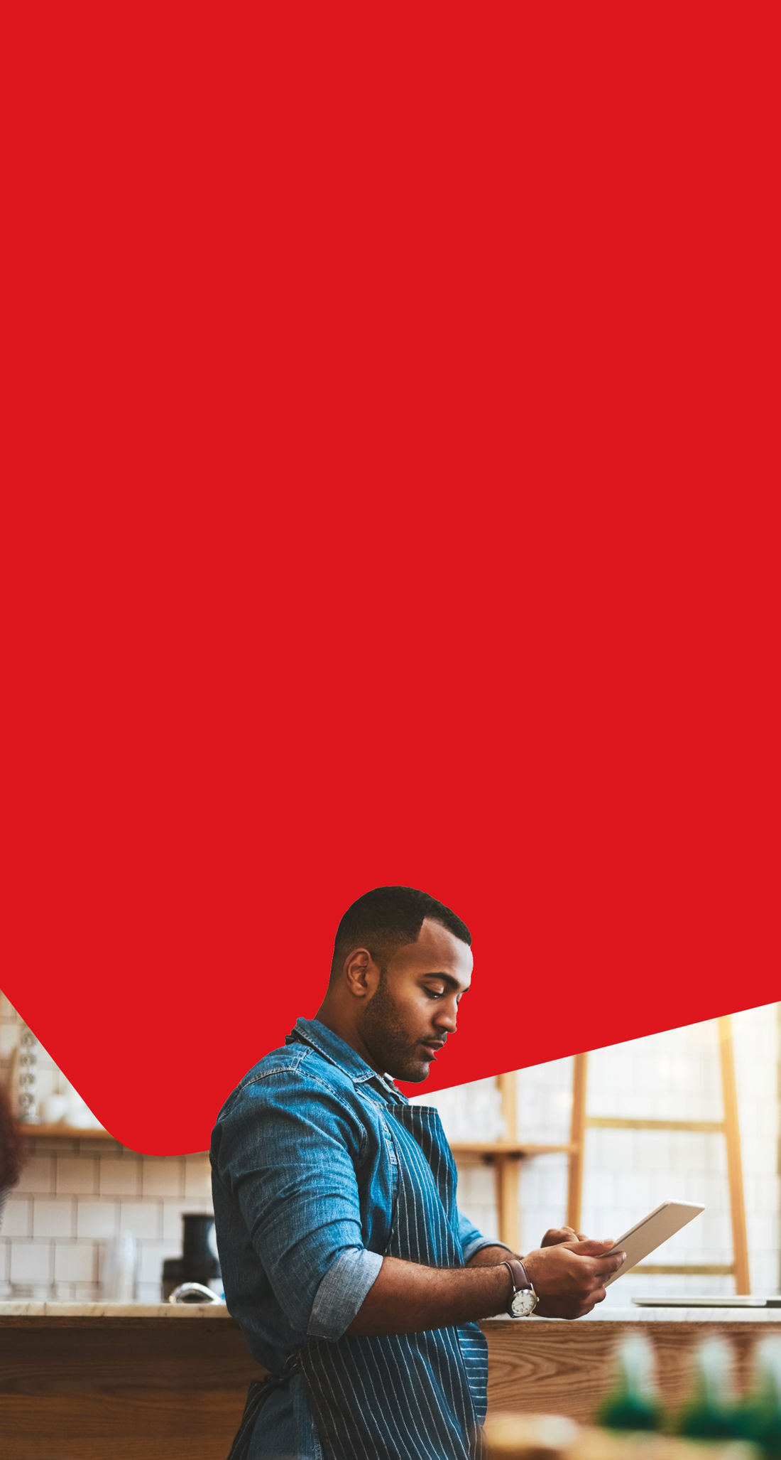 Photo of an entrepreneur using their National Bank online banking for business on their tablet 