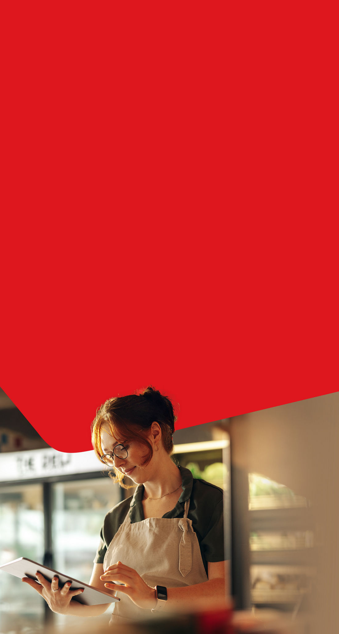 Photo of a business owner making an Interac e-Transfer on their tablet 