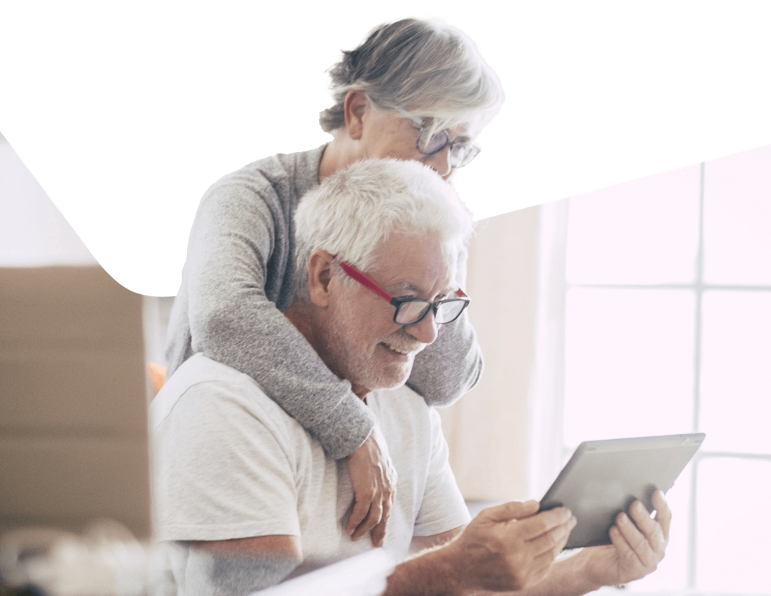 Photo of a retired couple in Florida checking their Zelle transfers on a tablet