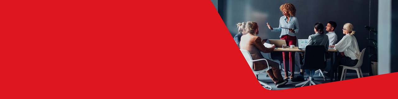 Photo of a SME business owner using National Bank services doing a presentation for their colleagues at an office