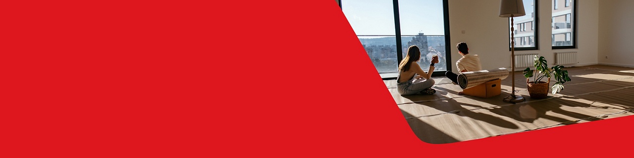 Photo of a couple looking out the window while thinking about our rates