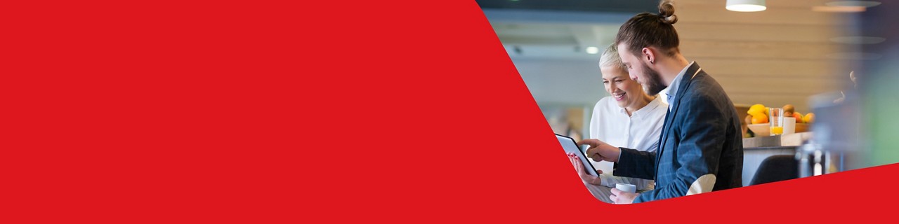 Photo of an advisor with a tablet explaining retirement pension plan to a client 