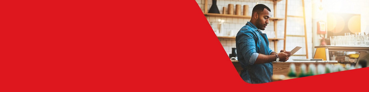 Photo of an entrepreneur using their National Bank online banking for business on their tablet 