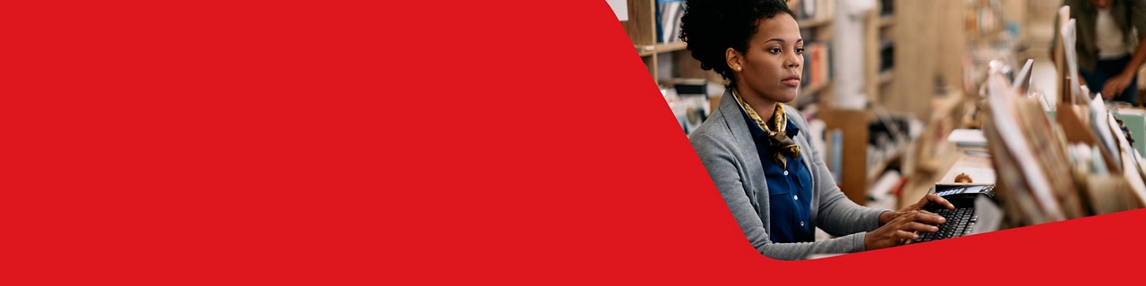 Photo of an entrepreneur working on their computer paying their suppliers with our payables solutions 